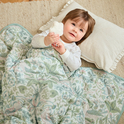 Baby in Strawberry Thief Slate Blue cozy blanket close-up, lifestyle