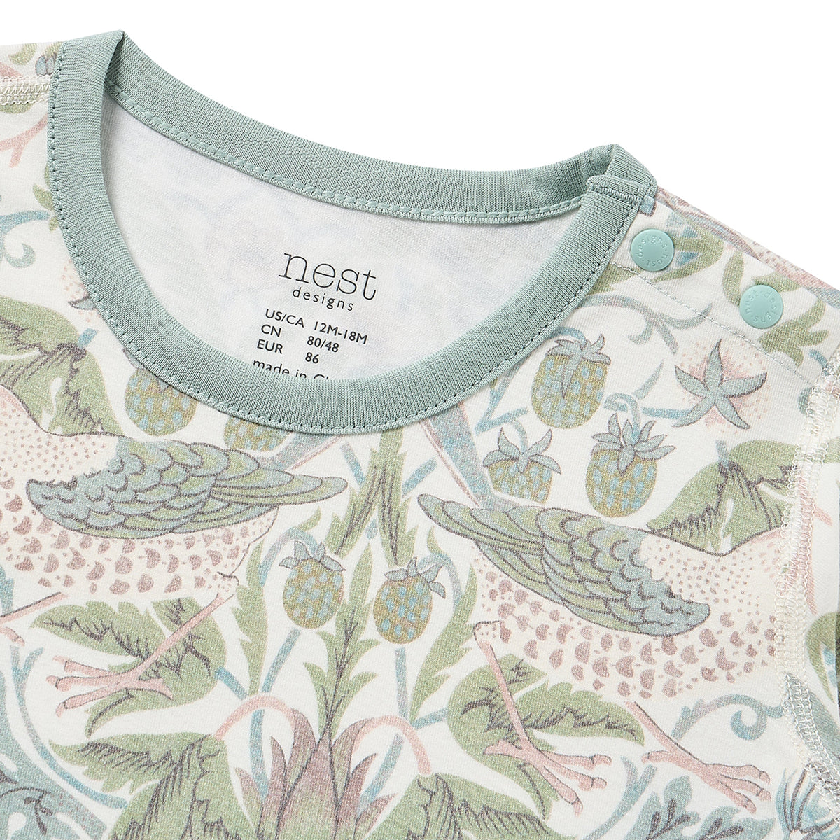 Close-up of neckline label and snaps on Kimono Onesie