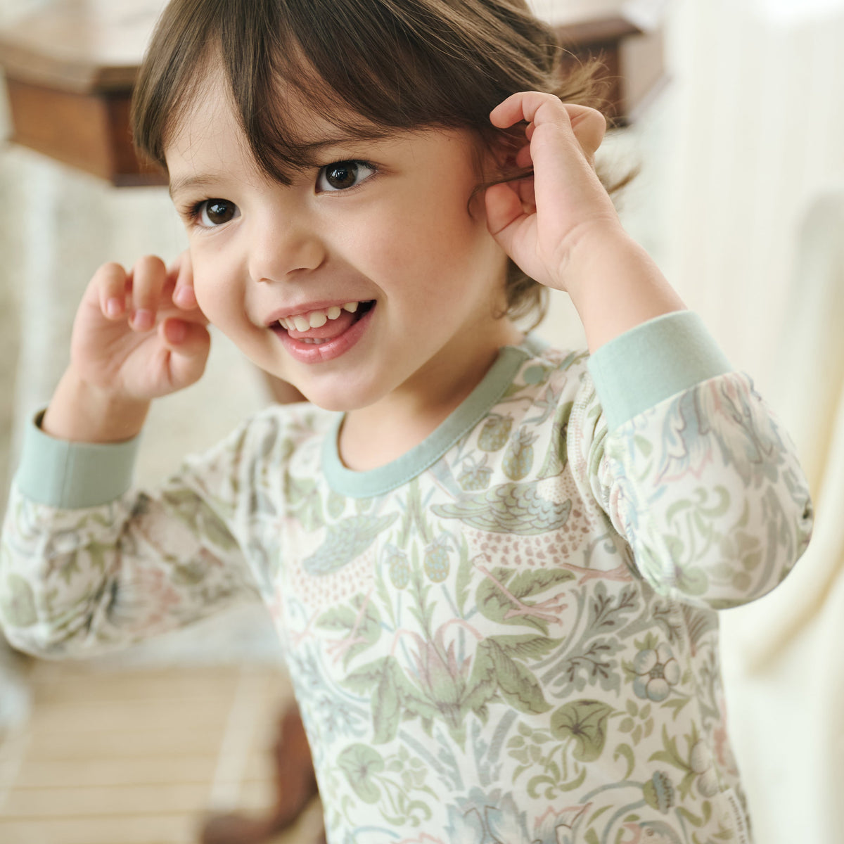 Smiling child wearing Bamboo Cotton Jersey Long Sleeve Kimono Onesie